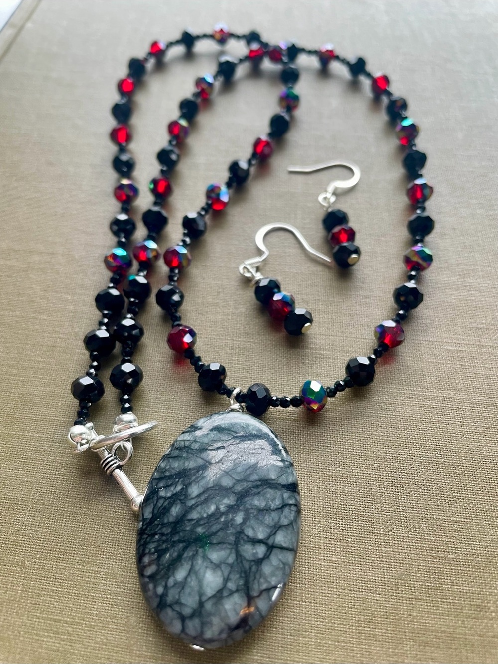 Handcrafted Black and Garnet Beaded Necklace with Oval Stone Pendant
